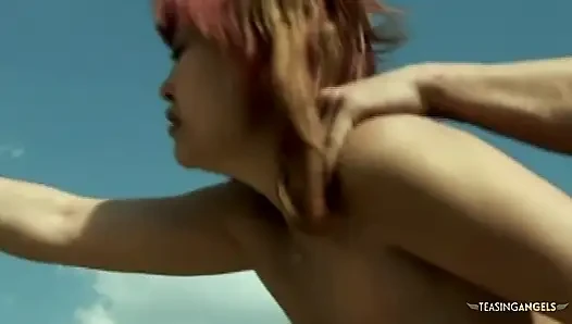An Asian woman with a large buttocks engages in sexual activities with aroused men in an outdoor setting
