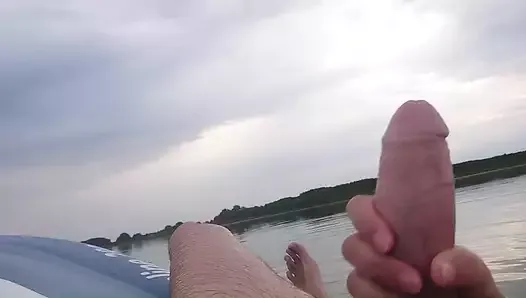 My wife jerks my cock with a happy ending in the inflatable boat on the lake