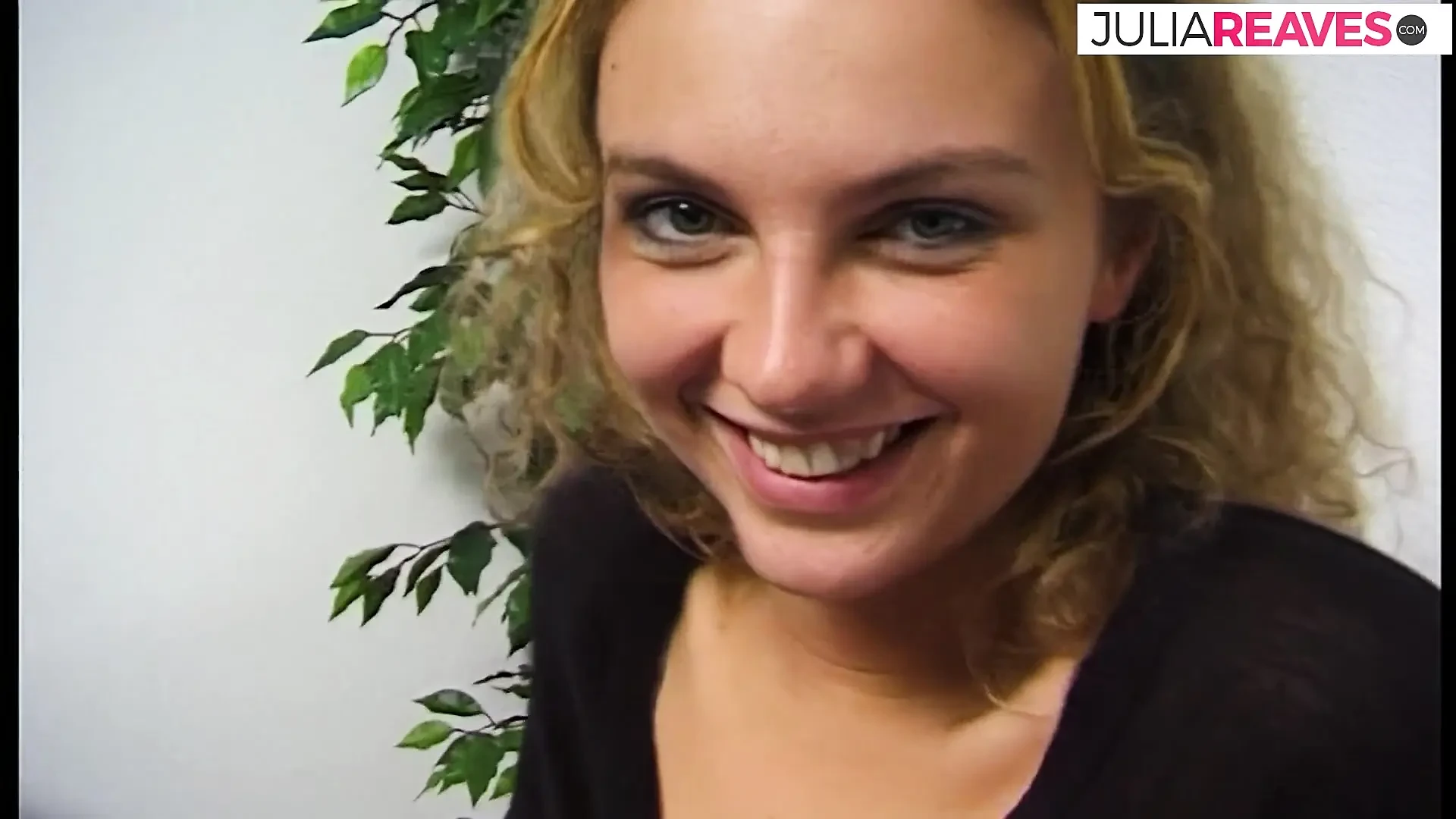 Blonde girl strips and spreads legs on the bed