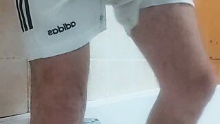 Pissing in my Amsterdam footie jersey and white Adidas shorts