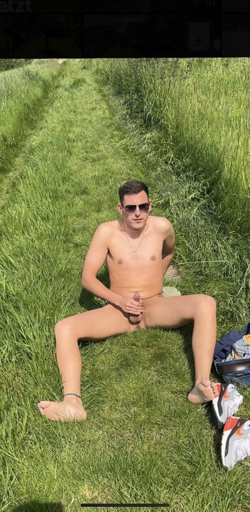 German twink jerks off naked outside until he cums