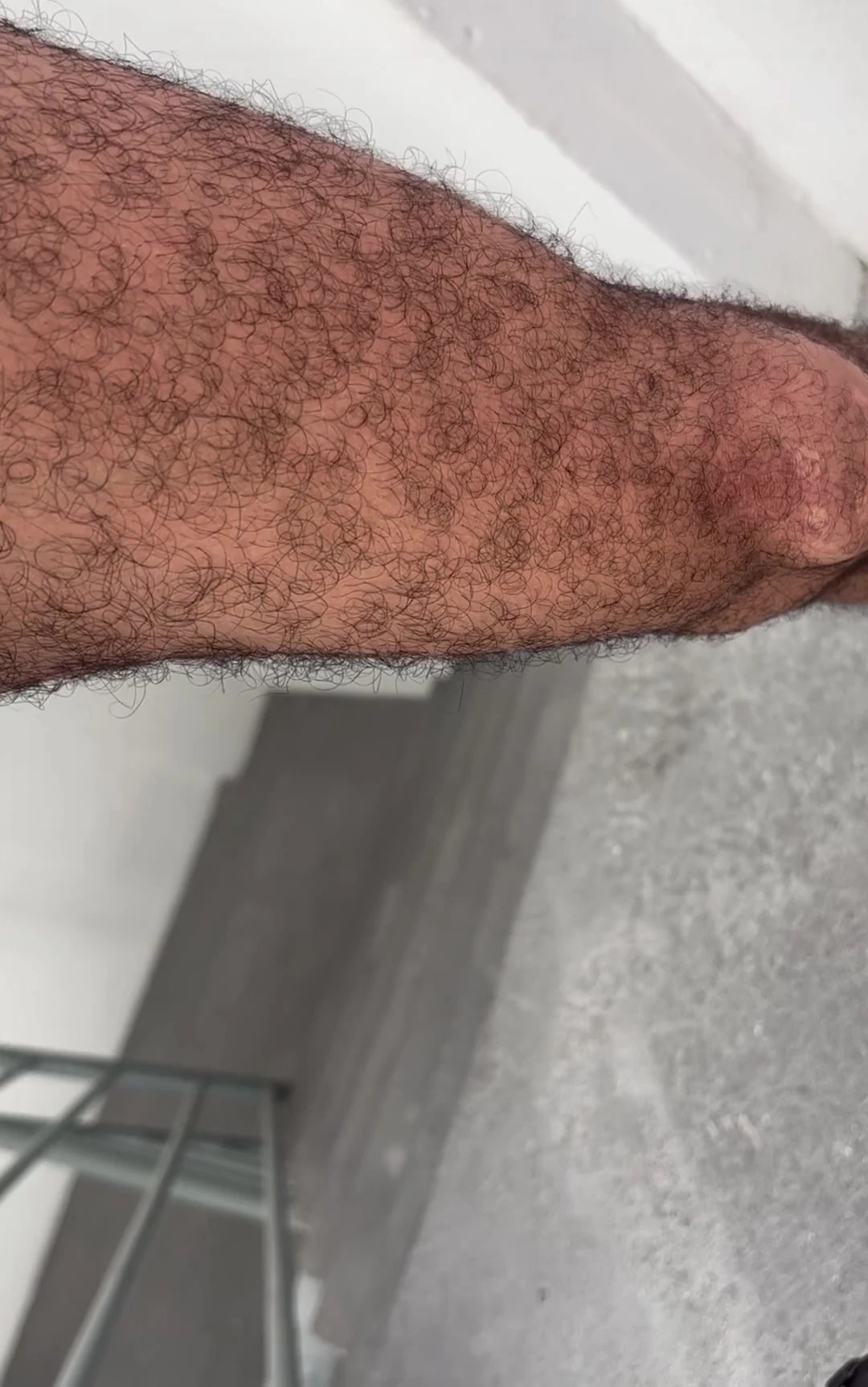 Hairy dad jerking off on the fire escape with a big hairy cock and cumming hard