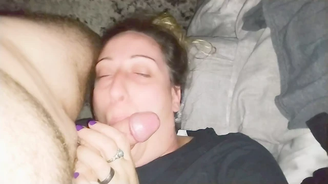 Sucking the balls and swallow with a smile