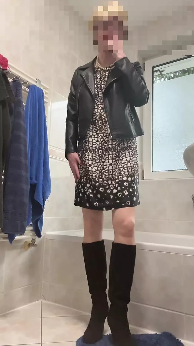 In high heels, leather jacket and dress
