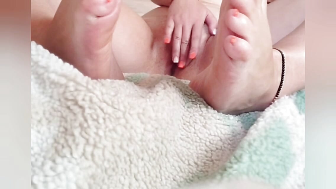 Morning orgasm! A girl with beautiful legs caresses her pussy.