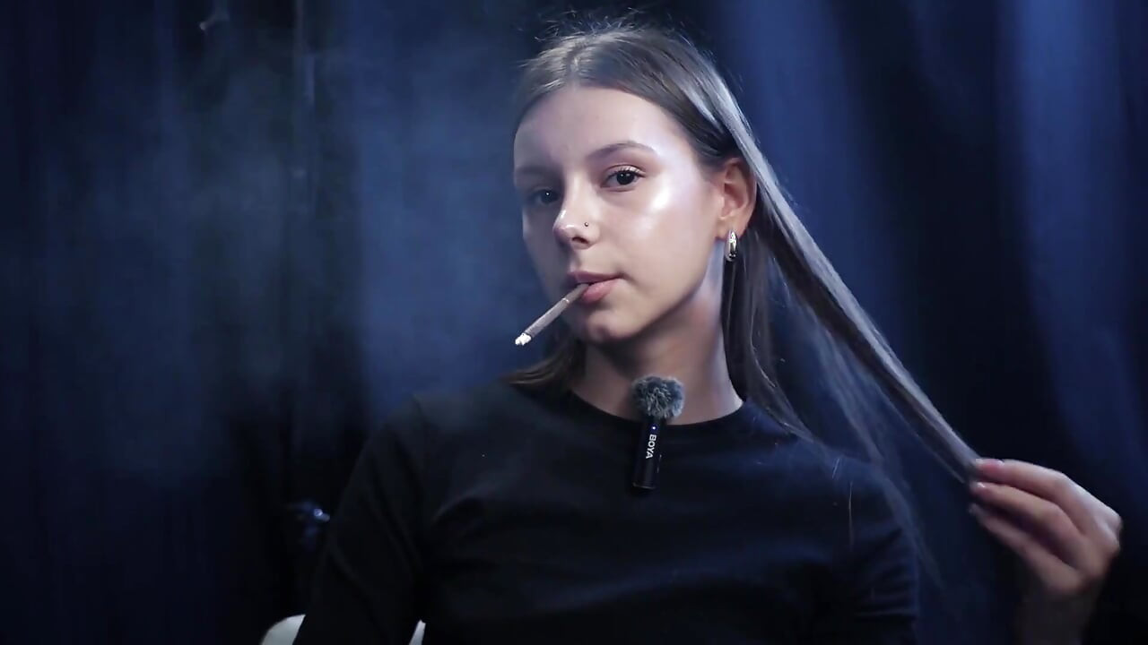 Young Girl Smoking Solo in a Calm Studio Session with Slow Exhales