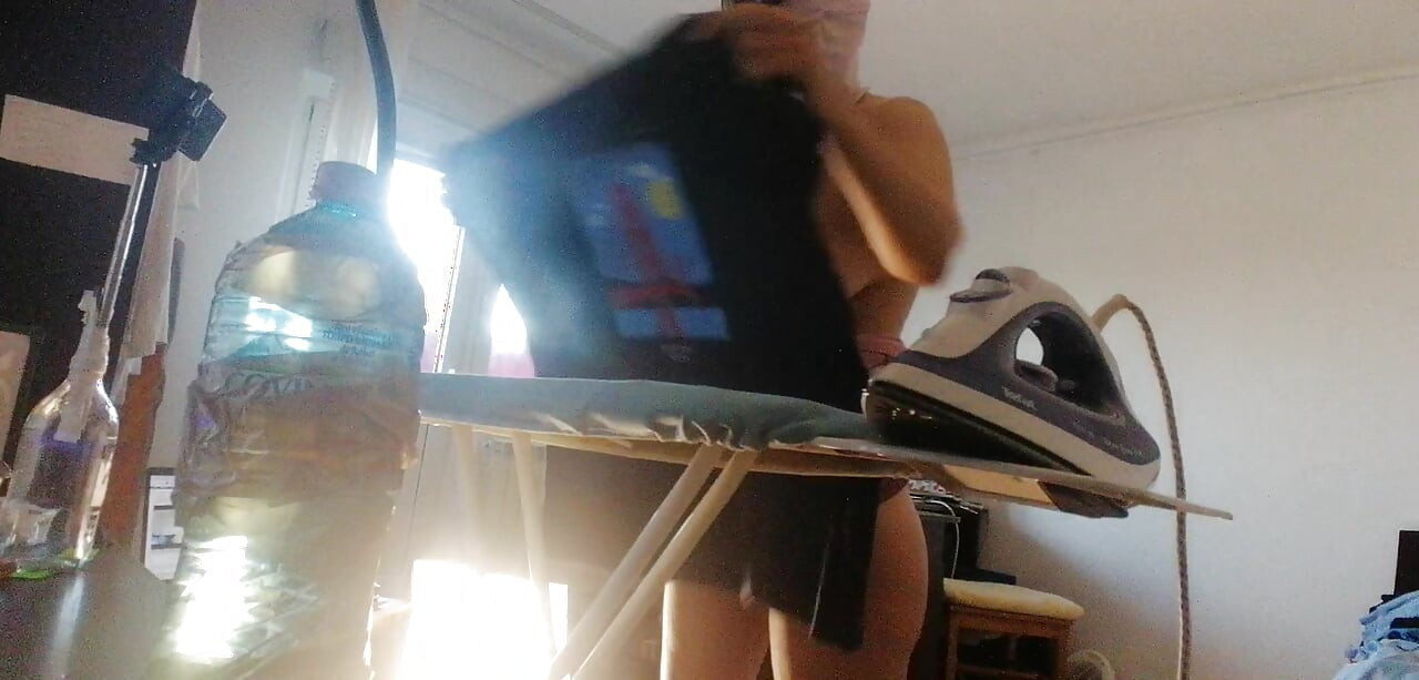 Amateur wife doing housework naked. Sexy and naughty wife trying on clothes that she cuts.