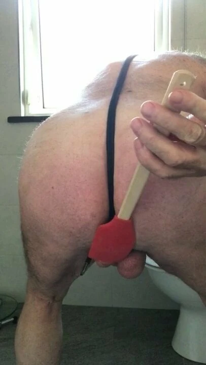 Beating tied cock and balls
