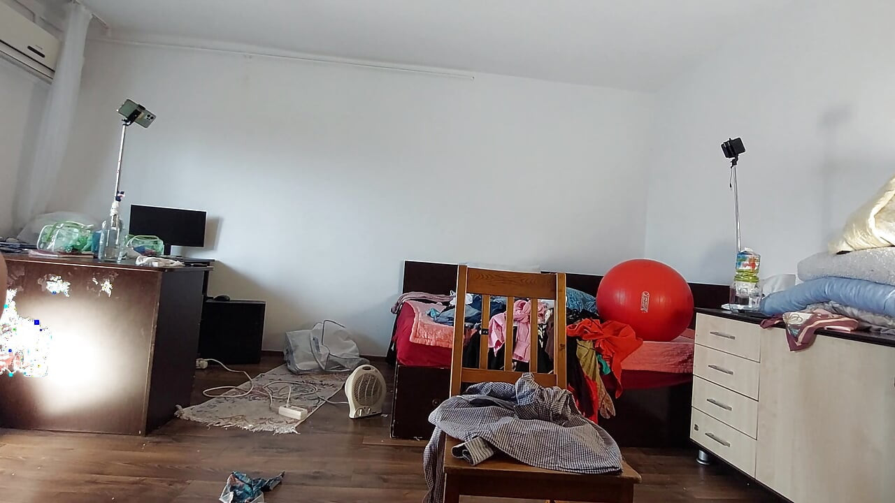 The sexy wife has fun testing clothes and cuts them. The brunette dances naked through the house.