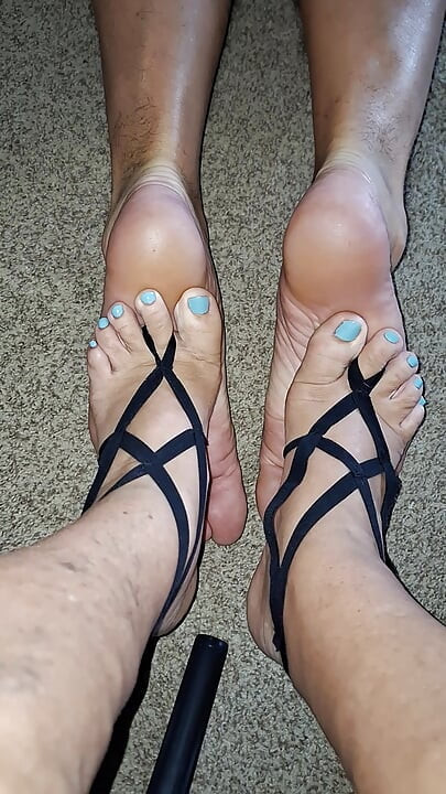 My girlfriend massages the soles of my feet with her soft  feet