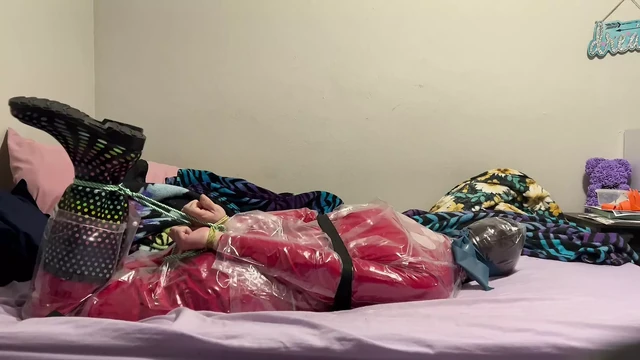 Bondage clear rainsuit and red pvc catsuit