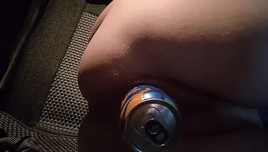 Slut in the evening in the parking lot fucks herself with a can of energy drink in the car