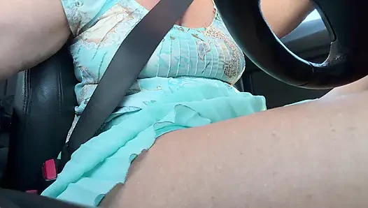 An elegant lady drives to work and rubs her pussy with her hand between her hot thighs