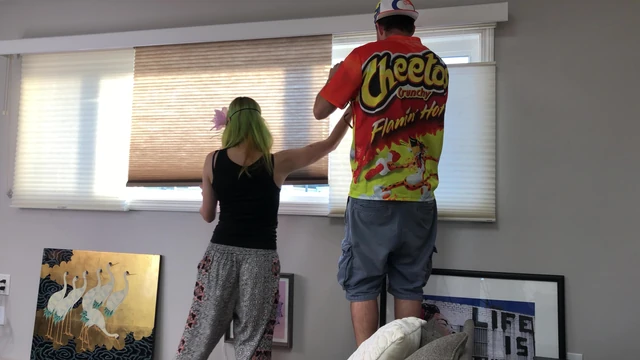 Couple Peeping Outside Apartment Window