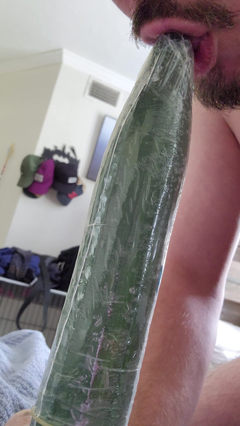 Horny bottom tries to deepthroat cucumber
