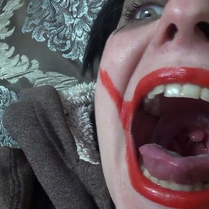 Two crazy clown girls dangle you above their hungry mouths before fighting over who will eat you alive
