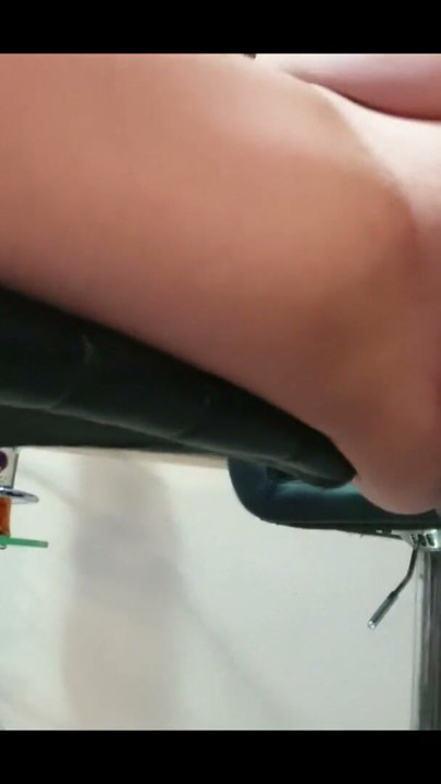 Chubby whore sits on a rotating chair, smoking with her legs open | Clip 1