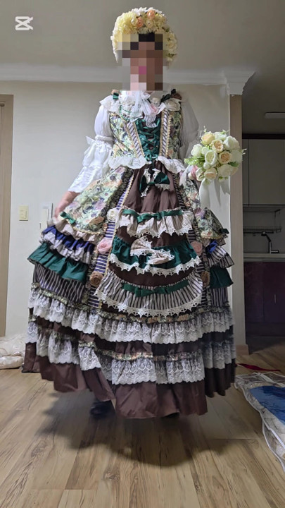 A crossdressing man is wearing a dress and dancing.