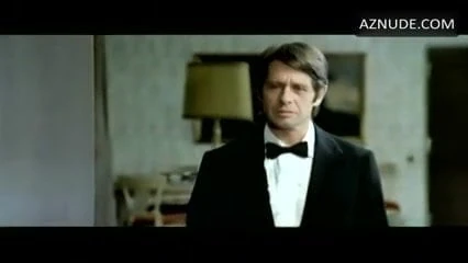 D. Haddon in 1975 movie in black satin bikini panty