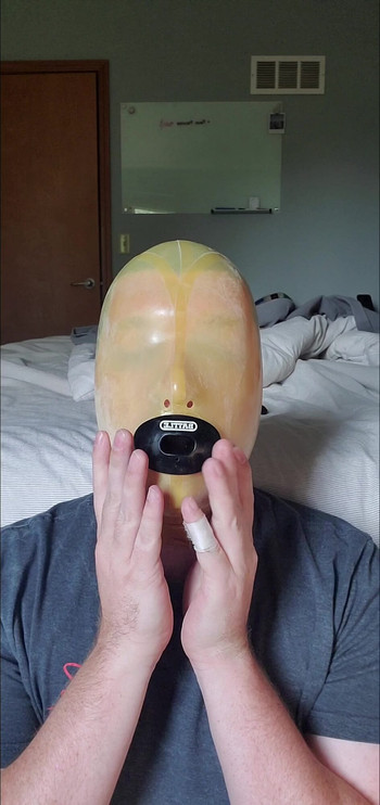 Latex Hooded Slut Swallows Load from Condom