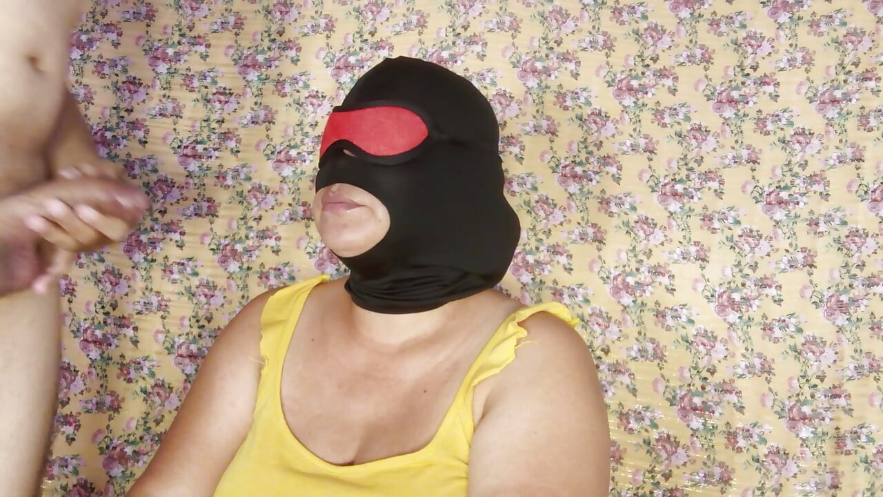 Beautiful mature masked woman giving delicious deep throat blowjob