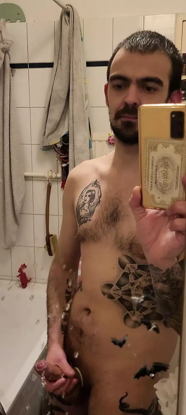 Me un front of the bathroom mirror