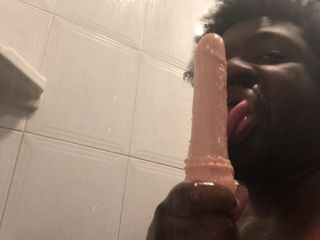 Sucking a didlo in the shower