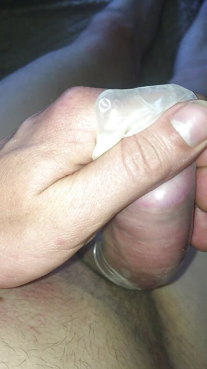 Handjob in a gandon, when will he already cum ....