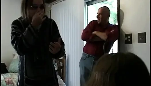 She pulls her legs back to give him a footjob