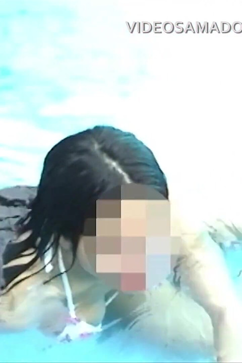 Fitness brunette girl shows off in motel pool for erotic video