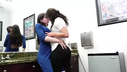 Horny lesbian finger fucks her girlfriend&#039;s cunt in an office