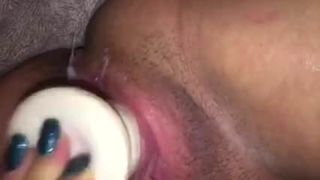 Close-up dildo in creamy pussy