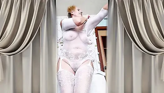 Hot housewife Lukerya flirts in an open transparent white jumpsuit in the kitchen 2