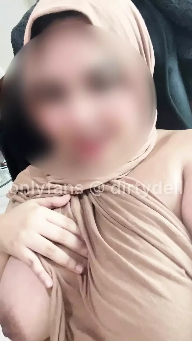 Passionate hijab sucks dildo