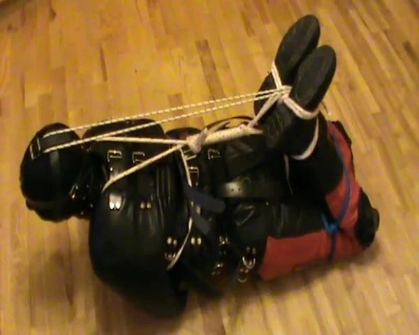 Hogtied in a straitjacket