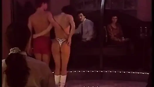 Blonde stripper bends showing shaved pussy