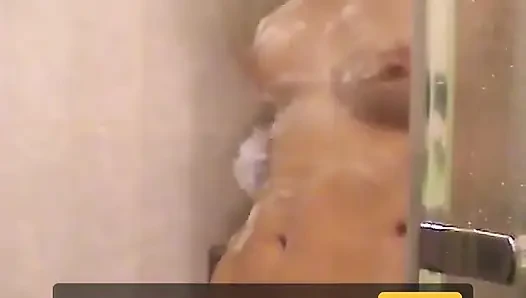 Cute brunette teen soaps up in the shower and takes time to trim her bush