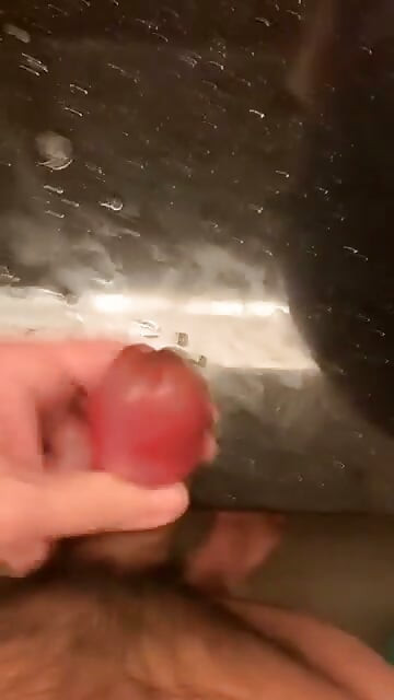 rubbing my big swollen cock head until i sprayed all over the table