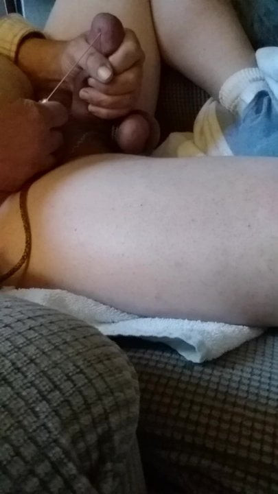 Needle through cock head