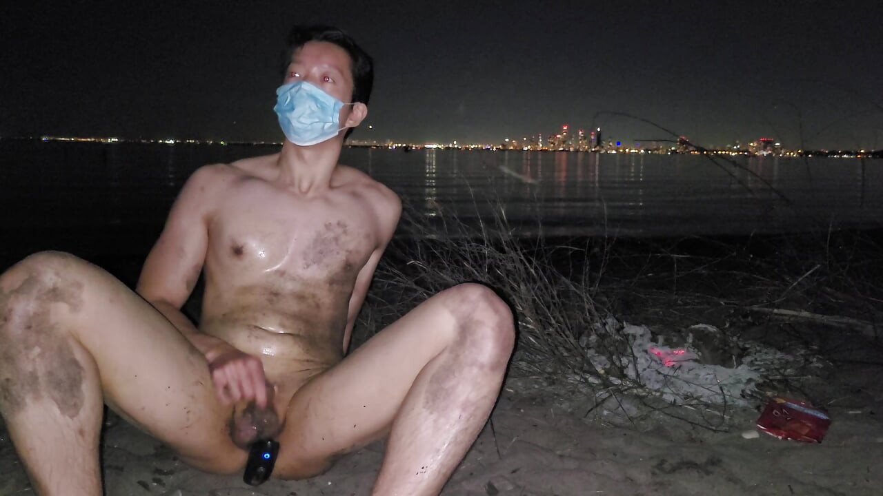 oiled masturbating and piss on the nude beach at night