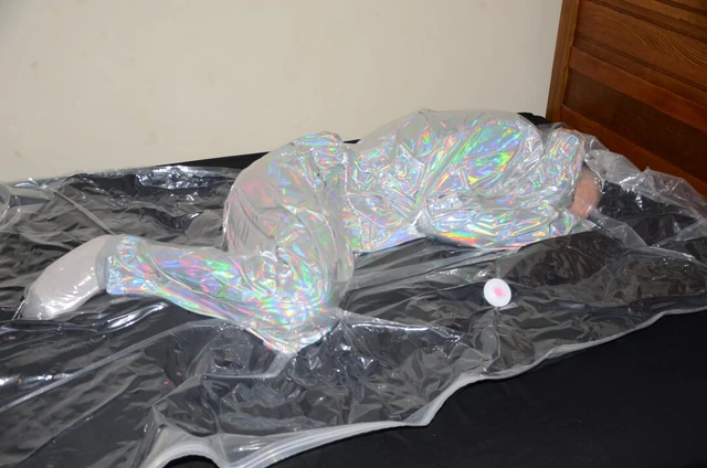 Dec 18 2022 - VacPacked in Mr Riegillio shiny PVC tracksuit with PVC aprons & face shield