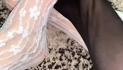 Massaging feet in sexy socks with hands in gloves