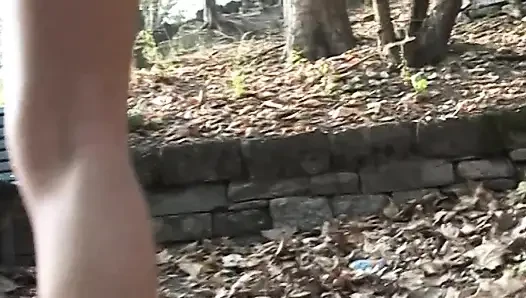 Hot and sexy milf fingers her pussy on the bench of a park