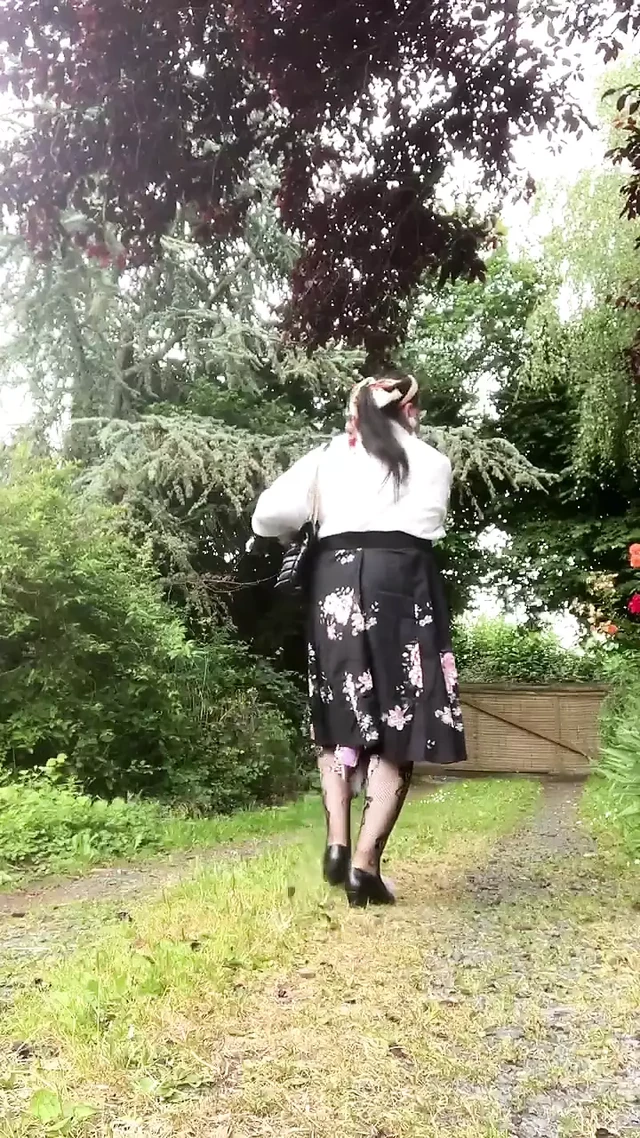 Dressed with a black midi skirt with flowers for a night out