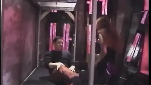 Hot dominatrix in leather with a great body puts a guy in clamps