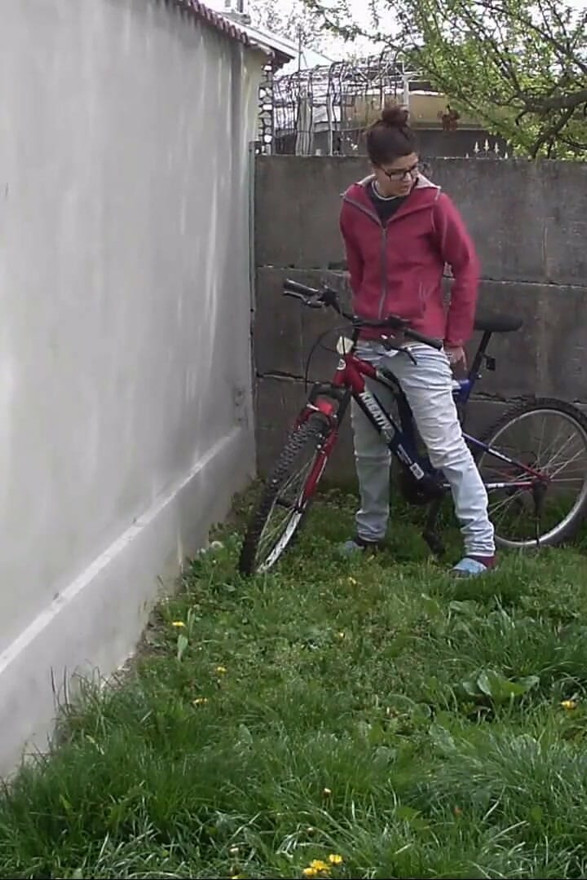Pissing in the backyard on a cold day, and leaving on her bike