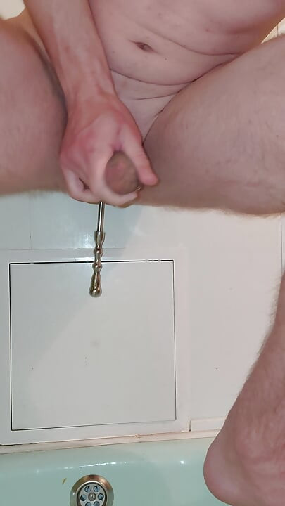 Shaving a large, tattooed, pierced penis that cums endlessly, hands-free