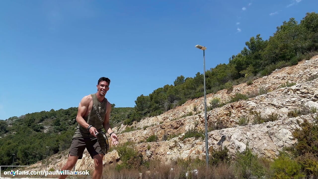Fitness man training padel naked outdoor