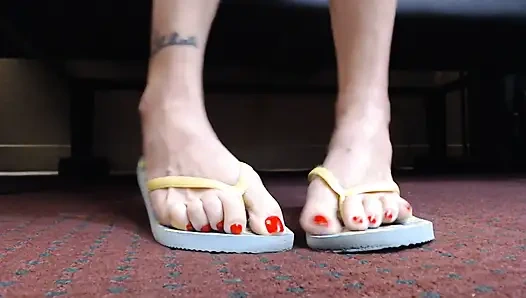 Toe wiggling in flipflops closeup