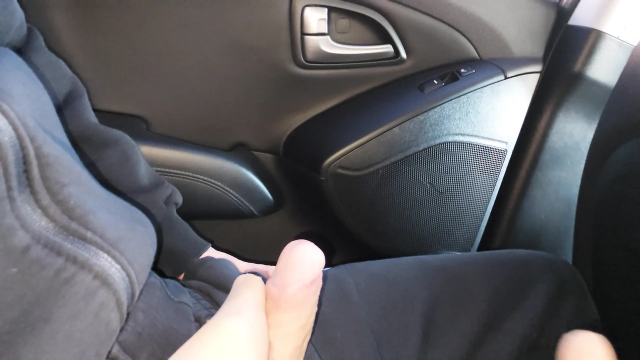 Real amateur stepmom seduces and teases her stepson and gives him a footjob in the car, in public